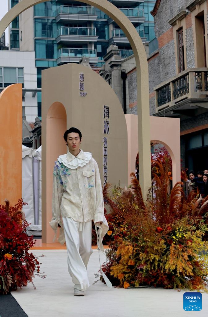 A model presents a creation during a fashion show held at Zhangyuan, or Zhang's Garden, in east China's Shanghai, Dec. 7, 2024. With the century-old Shikumen complex as the background and the Maoming North Road as the runway, a fashion show was held here on Saturday, bringing together the creations of many outstanding young designers in China. Photo: Xinhua