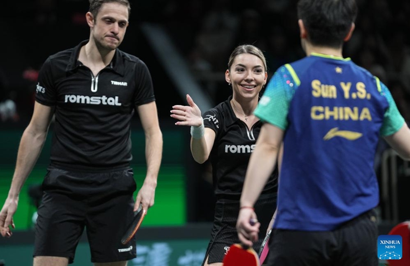 Ovidiu Ionescu (back L)/Bernadette Szocs (back R) of Romania greet with Wang Chuqin/Sun Yingsha of China after their game during the semifinal match between China and Romania at the ITTF Mixed Team World Cup 2024 in Chengdu, southwest China's Sichuan Province, Dec. 8, 2024. Photo: Xinhua