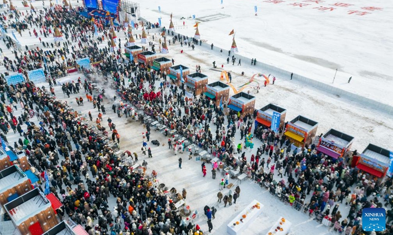 An aerial drone photo shows a view of an ice collecting festival in Harbin, northeast China's Heilongjiang Province, Dec. 7, 2024. Marking the beginning of Harbin's ice collecting season, the fifth ice collecting festival kicked off here by the Songhua River on Saturday, attracting lots of people with ice collecting ceremony and performances. Photo: Xinhua