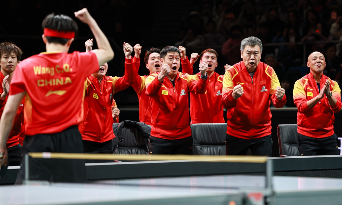 Chinese players and coaches celebrate a point against South Korea in the ITTF Mixed Team World Cup 2024 final in Chengdu, Southwest China's Sichuan Province, on December 8, 2024. The Chinese table tennis team won gold with a 8-1 victory. Photo: VCG