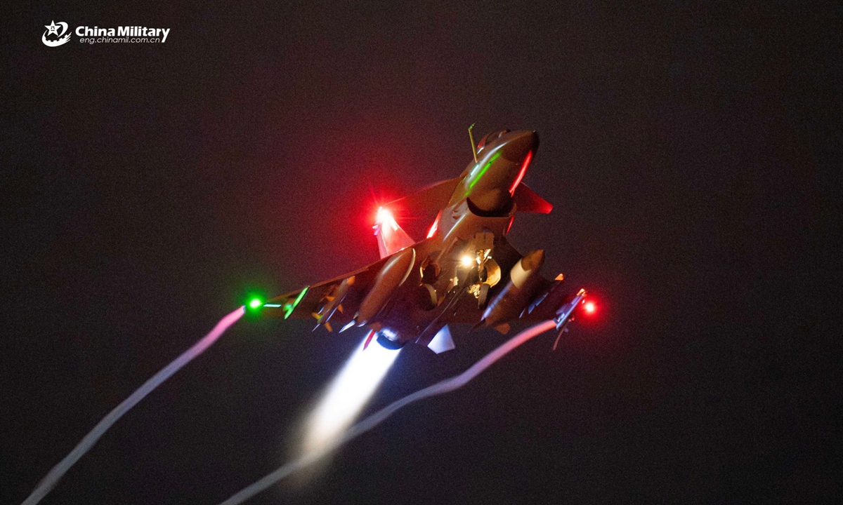 A J-10 fighter jet attached to an aviation brigade with the air force under Chinese PLA Southern Theater Command takes off for a nighttime flight training exercise. The exercise started at midnight and lasted until dawn. (eng.chinamil.com.cn/Photo by Wang Guoyun)