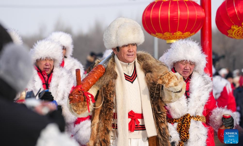 Ice collecting crew walk to collect ice during an ice collecting festival in Harbin, northeast China's Heilongjiang Province, Dec. 7, 2024. Marking the beginning of Harbin's ice collecting season, the fifth ice collecting festival kicked off here by the Songhua River on Saturday, attracting lots of people with ice collecting ceremony and performances. Photo: Xinhua