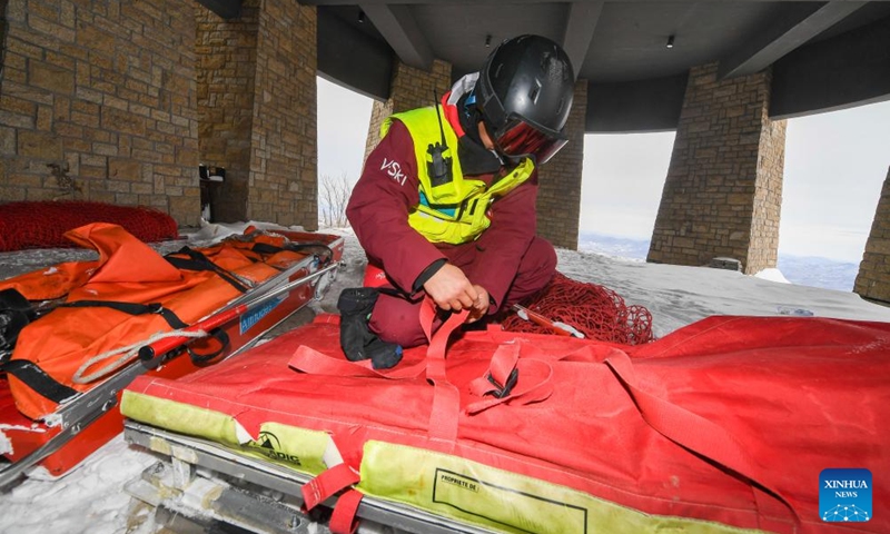 Yao He arranges the rescue equipment at Lake Songhua Resort in Jilin City, northeast China's Jilin Province, Dec. 5, 2024. Photo: Xinhua