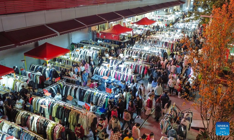 An aerial drone photo taken on Dec. 7, 2024 shows a night fair on a street in Kunming City, southwest China's Yunnan Province. In recent years, Kunming has stepped up its efforts to enrich citizen's life by developing night fair compounds. Photo: Xinhua