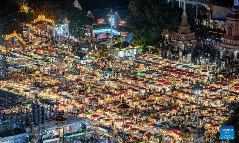 This photo shows a view of the Starlight Night Market in Jinghong City of Xishuangbanna Dai Autonomous Prefecture, southwest China's Yunnan Province, Dec. 7, 2024. The night market is a destination to experience the customs of Dai ethnic group. Photo: Xinhua