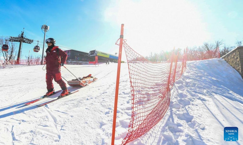 Yao He carries a rescue sled on the ski slopes at Lake Songhua Resort in Jilin City, northeast China's Jilin Province, Dec. 7, 2024. Photo: Xinhua