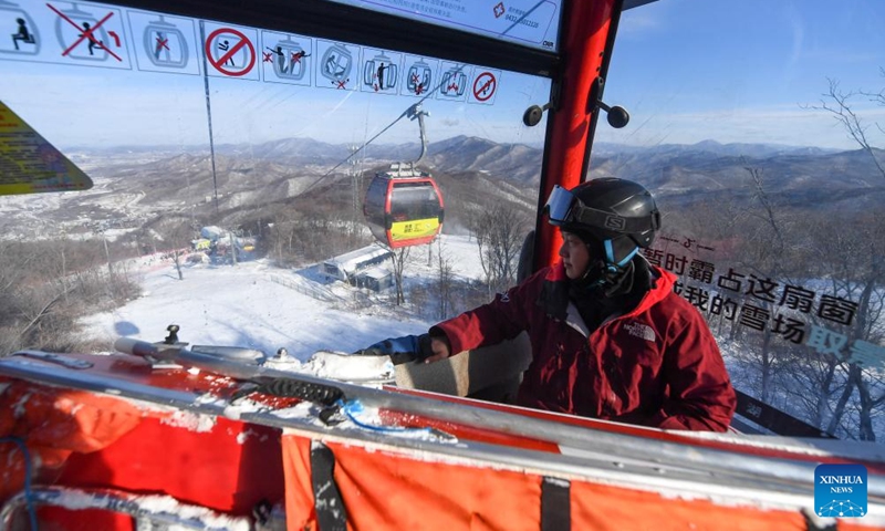 Yao He takes a cable car to inspect the condition of ski slopes at Lake Songhua Resort in Jilin City, northeast China's Jilin Province, Dec. 7, 2024. Photo: Xinhua