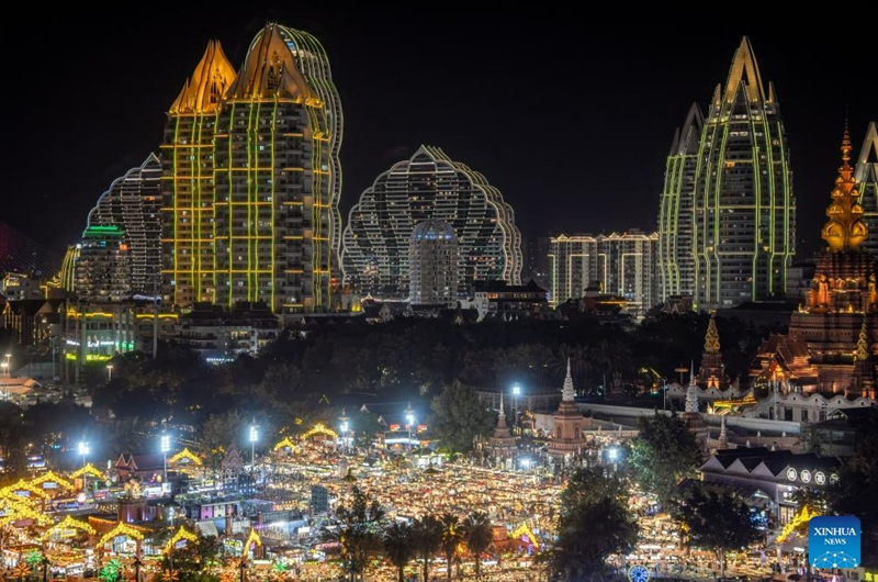 This photo shows a view of the Starlight Night Market in Jinghong City of Xishuangbanna Dai Autonomous Prefecture, southwest China's Yunnan Province, Dec. 7, 2024. The night market is a destination to experience the customs of Dai ethnic group. Photo: Xinhua