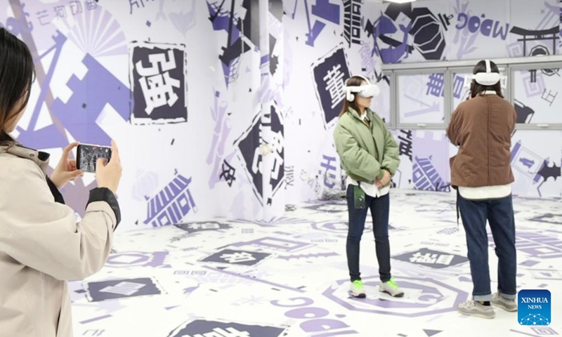 Visitors try out VR devices at the BlueFocus (Tianjin) Digital Service Industry Promotion Center in north China's Tianjin Municipality, Nov. 15, 2024. (Photo: Xinhua)