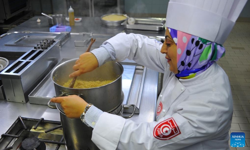 A chef prepares couscous, a traditional food, during a food competition in Hammamet, eastern Tunisia, on Dec. 9, 2024. A couscous food competition is held here from Dec. 4 to Dec. 10. (Photo:Xinhua)