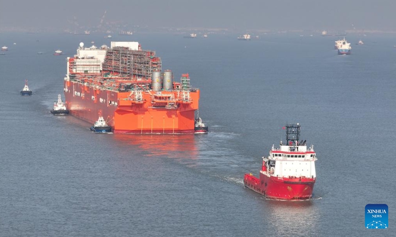 This aerial drone photo taken on Dec. 9, 2024 shows the NGUYA FLNG, a floating liquified natural gas (FLNG) facility, being tugged in the Taicang section of the Yangtze River in east China's Jiangsu Province.  (Photo: Xinhua)