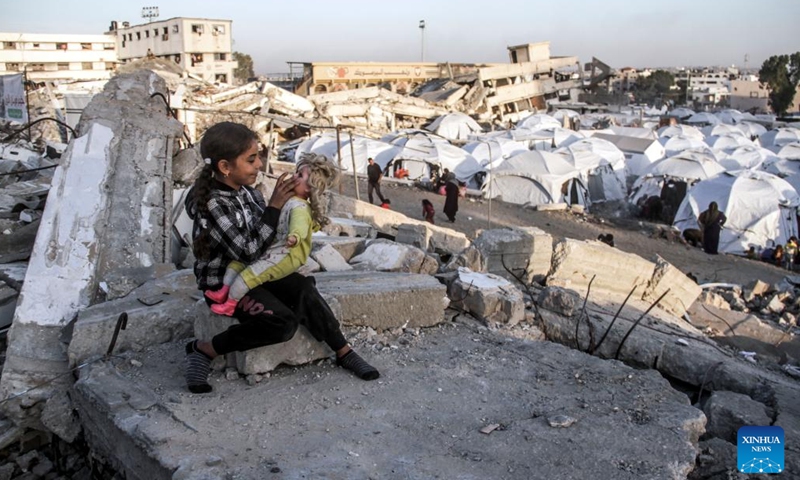 A displaced Palestinian child plays in a shelter in Gaza City on Dec. 9, 2024. (Photo:Xinhua)