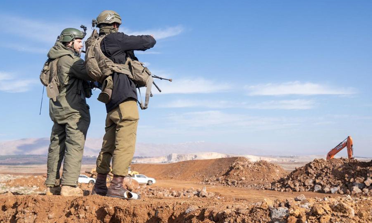 This photo released by Israel Defense Forces on Dec. 6, 2024 shows Israeli soldiers standing guard in the Israeli-occupied Golan Heights. (Photo: Xinhua)