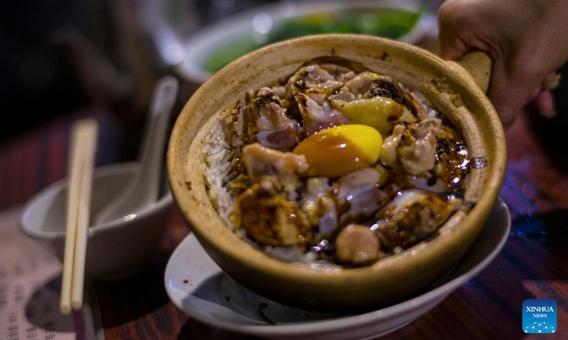 This photo shows a portion of clay pot rice in Macao, south China, Dec. 8, 2024. (Photo: Xinhua)