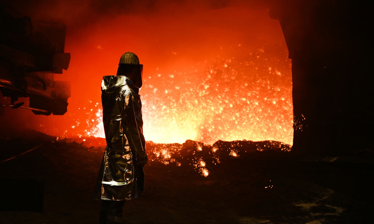 A worker is seen at a blast furnace at the steel works of Thyssenkrupp Steel Europe AG in Duisburg, western Germany, on December 10, 2024. German industrial giant Thyssenkrupp said at the end of November 2024 that it planned to cut around 5,000 jobs at its steel subsidiary by 2030 and outsource a further 6,000 as it looks to put the crisis-hit division on a stable footing. Photo: VCG