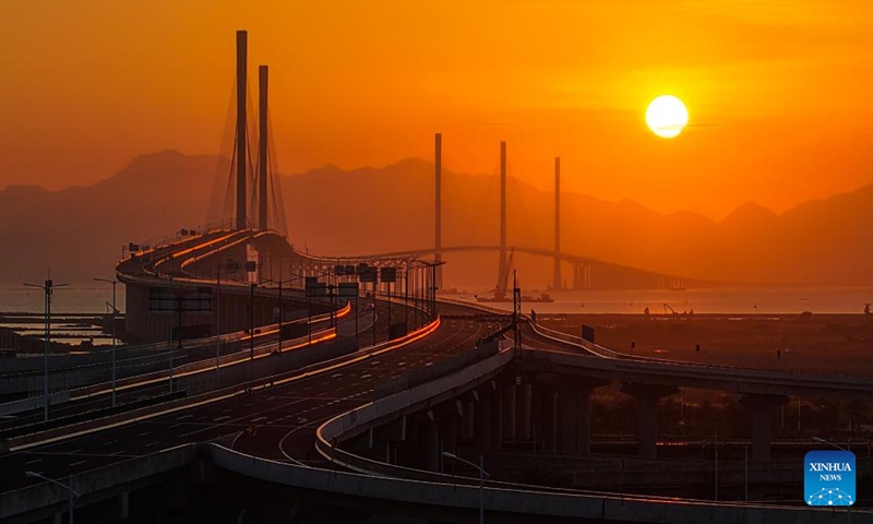 An aerial drone photo taken on Dec. 4, 2024 shows a view of Gaolan Port Bridge (with twin main towers on the left) and Huangmaohai Bridge (with three main towers on the right) in south China's Guangdong Province. (Photo: Xinhua)