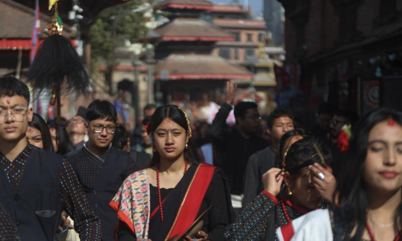 People in traditional attire join a rally to celebrate Yomari Punhi in Kathmandu, Nepal, Dec. 15, 2024. Yomari Punhi is a festival especially celebrated by Newar community in Nepal to mark the end of the rice harvest on full moon day. (Photo by Sulav Shrestha/Xinhua)