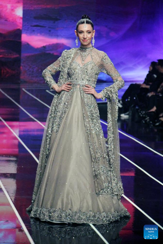 A model presents a creation on the first day of the Neo HUM Bridal Couture Week in Lahore, Pakistan on Dec. 20, 2024. A three-day bridal fashion week kicked off in Lahore on Friday. (Photo: Xinhua)