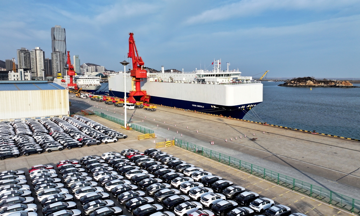 Cargo vessels load export vehicles at a port in Lianyungang, East China's Jiangsu Province, on December 12, 2024. In the first 11 months of 2024, China's auto exports rose 21.2 percent year-on-year. Photo: VCG