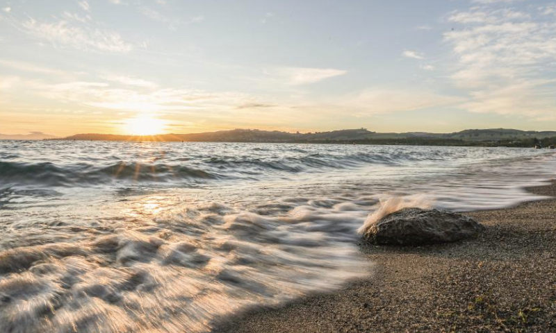 This photo taken on Dec. 14, 2024 shows Lake Taupo at sunset in Taupo, New Zealand. (Xinhua/Long Lei)