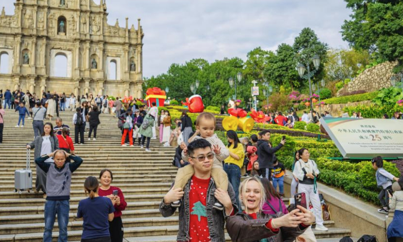 Tourists visit the Ruins of St. Paul's in south China's Macao, Dec. 12, 2024.

The historic center of Macao, a UNESCO world heritage site, bears witness to one of the earliest and longest-lasting encounters between China and the West.

The narrow and elongated area is dotted with historic buildings, from the A-Ma Temple dedicated to the sea-goddess Mazu, to the Mandarin's House -- the former residence of a prominent Chinese historical figure, and the landmark Ruins of St. Paul's, once among the largest Catholic churches in the Far East. (Xinhua/Zhu Wei)