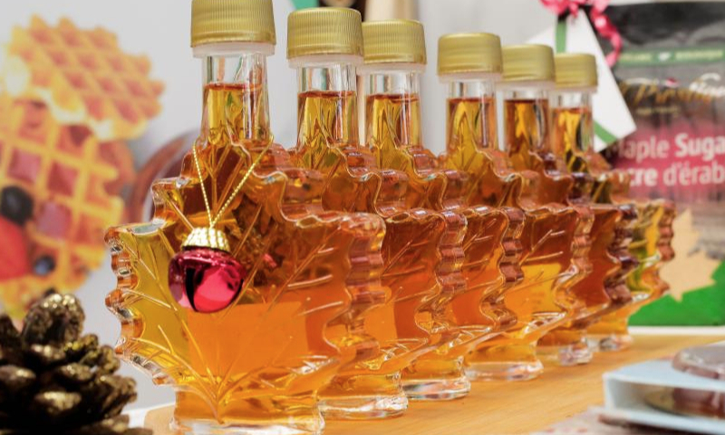 This photo taken on Dec. 22, 2024 shows an exhibition of apricot syrup during the 5th edition of Ivorian market for brands and creations in Abidjan, Cote d'Ivoire. (Photo by Laurent Idibouo/Xinhua)