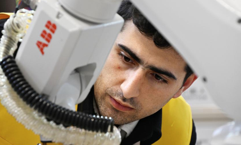 A competitor from Armenia competes in the third SCO Countries Worker Skills Contest in Qingdao, east China's Shandong Province, Dec. 18, 2024. The contest kicked off on Wednesday in Qingdao, attracting skilled workers competing in three programs. (Xinhua/Li Ziheng)

