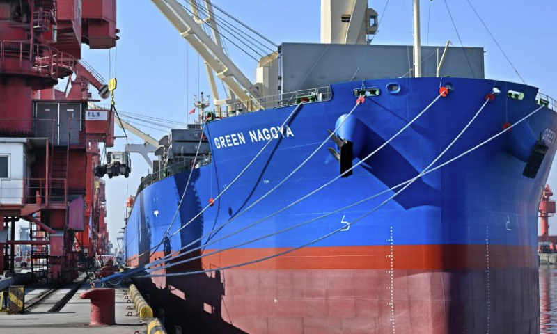 The cargo ship GREEN NAGOYA is seen at Qingdao Port in Qingdao, east China's Shandong Province, Dec. 16, 2024. The vessel is expected to arrive at the Dar es Salaam Port in Tanzania in about 20 days. A new direct shipping route between China's Qingdao and southeast Africa was officially opened on Monday. Running on a weekly basis, this route adds a safe and fast maritime shipping alternative between China and Africa. (Xinhua/Li Ziheng)