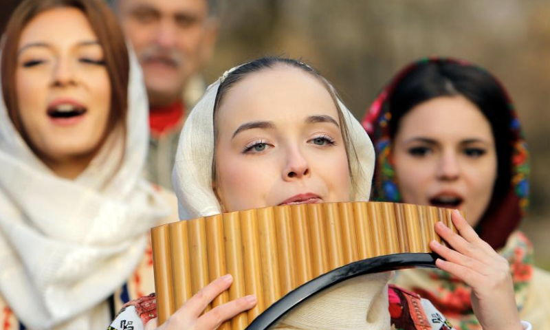 Members of a traditional band perform during the White Flowers festival of traditions and customs in Bucharest, Romania, on Dec. 14, 2024. (Photo by Cristian Cristel/Xinhua)