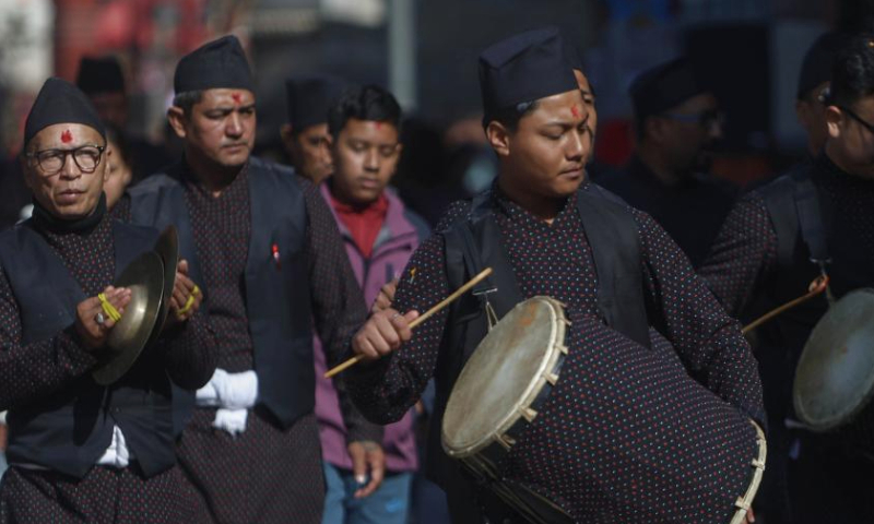 People in traditional attire perform during a rally to celebrate Yomari Punhi in Kathmandu, Nepal, Dec. 15, 2024. Yomari Punhi is a festival especially celebrated by Newar community in Nepal to mark the end of the rice harvest on full moon day. (Photo by Sulav Shrestha/Xinhua)