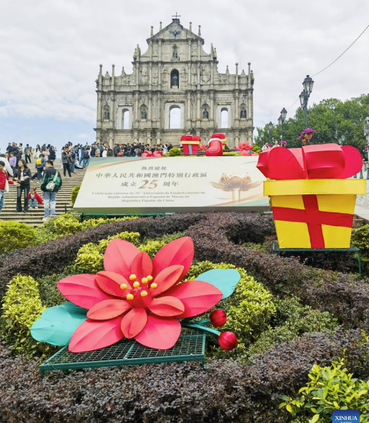 A celebration installation is seen in front of the Ruins of St. Paul's in Macao, south China, Dec. 18, 2024. The streets of Macao have been adorned by festive decorations, as the city is set to mark the 25th anniversary of its return to the motherland. (Xinhua/Lai Xiangdong)