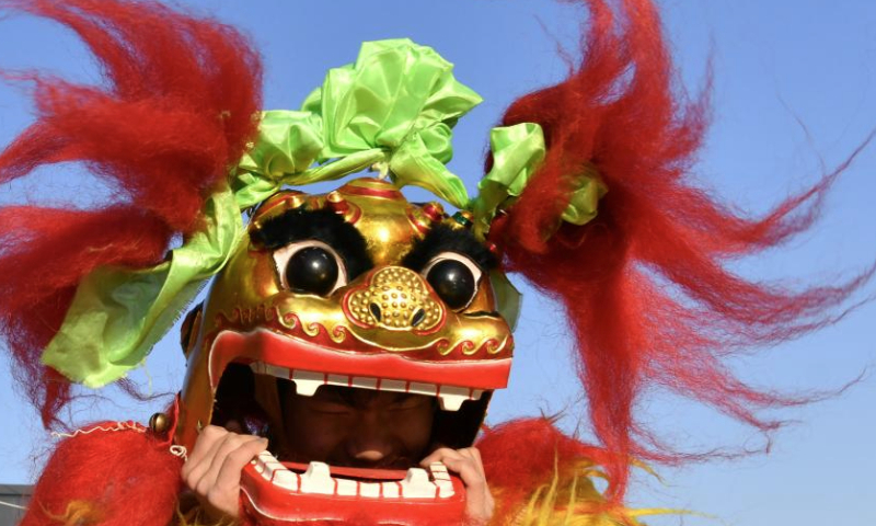 A trainee practices lion dance at a training base in Cangxian County, north China's Hebei Province, Dec. 20, 2024. Cangxian Lion Dance is a unique folk art with a long history, which was inscribed into the national intangible cultural heritage list in 2008. Thanks to the policy and funding support of local authorities in recent years, the traditional art has been well passed on. There are nine registered lion dance teams and nearly 1,000 performers in the county. (Xinhua/Mu Yu)