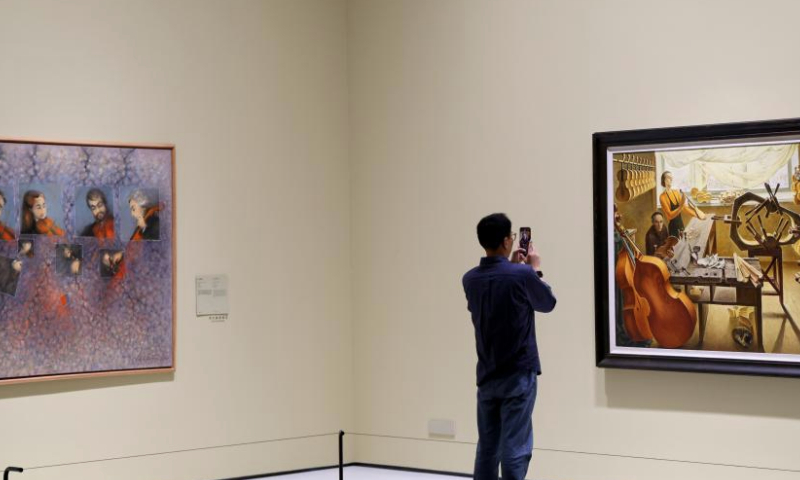 A man views an art work at the Guangdong Museum of Art in Guangzhou, south China's Guangdong Province, Dec. 6, 2024.

The Bai'etan Greater Bay Area Art Center in the southern Chinese metropolis of Guangzhou opened to the public on May 1, adding a new cultural landmark to the Guangdong-Hong Kong-Macao Greater Bay Area.

The art center, integrating the Guangdong Museum of Art, the Guangdong Intangible Cultural Heritage Museum and the Guangdong Literature Museum, has a total construction area of approximately 145,000 square meters, including an exhibition area of over 40,000 square meters and a shared public area of 35,000 square meters. (Xinhua/Lu Hanxin)