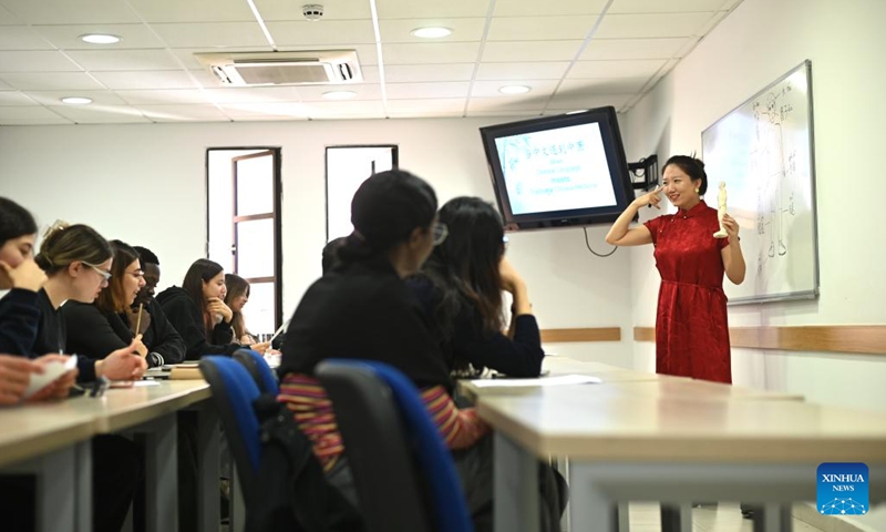 Students attend a cultural event themed When Chinese Language Meets Traditional Chinese Medicine at the University of Malta in Msida, Malta, on Dec. 11, 2024. (Photo: Xinhua)