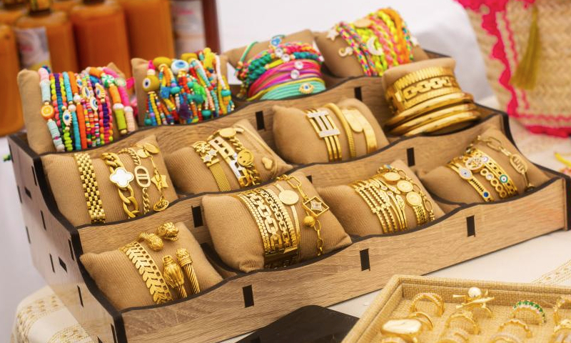 This photo taken on Dec. 22, 2024 shows an exhibition of ornaments made of stainless steel during the 5th edition of Ivorian market for brands and creations in Abidjan, Cote d'Ivoire. (Photo by Laurent Idibouo/Xinhua)