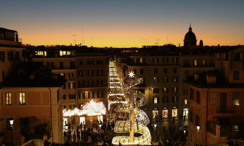 People visit Spanish Steps decorated with festive lights in Rome, Italy, Dec. 17, 2024. (Xinhua/Li Jing)