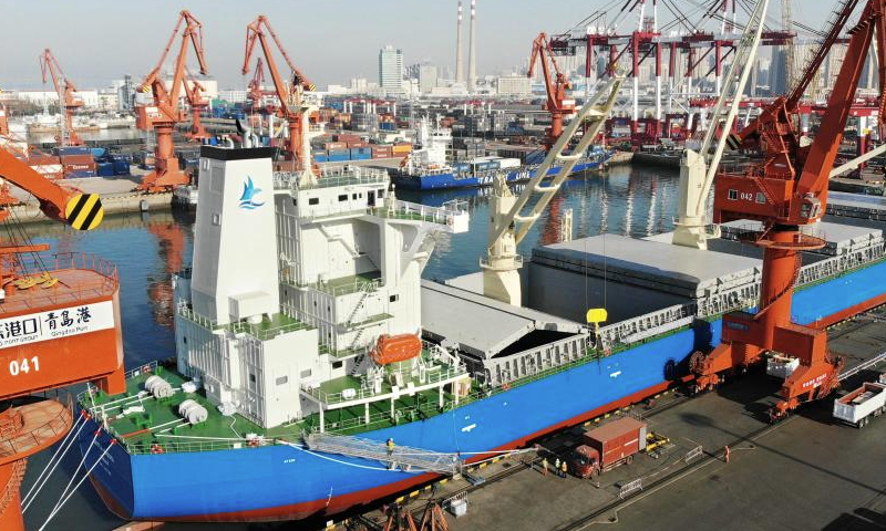 The cargo ship GREEN NAGOYA waits to be loaded at Qingdao Port in Qingdao, east China's Shandong Province, Dec. 16, 2024. The vessel is expected to arrive at the Dar es Salaam Port in Tanzania in about 20 days. A new direct shipping route between China's Qingdao and southeast Africa was officially opened on Monday. Running on a weekly basis, this route adds a safe and fast maritime shipping alternative between China and Africa. (Xinhua/Li Ziheng)