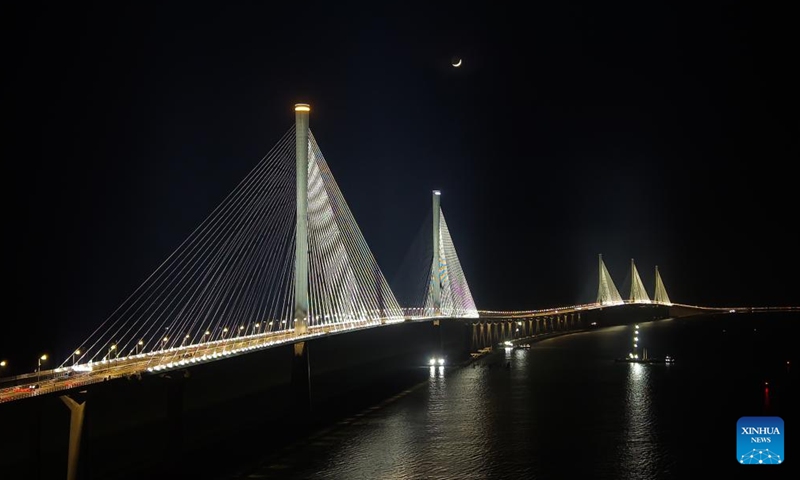 An aerial drone photo taken on Dec. 4, 2024 shows a view of Gaolan Port Bridge (with twin main towers on the left) and Huangmaohai Bridge (with three main towers on the right) in south China's Guangdong Province. (Photo: Xinhua)