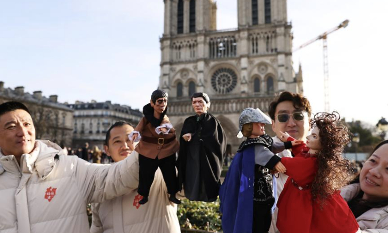 Chinese actors perform a hand-puppet theater play Notre-Dame de Paris in front of the Notre-Dame de Paris cathedral, in Paris, France, Dec. 15, 2024. Chinese actors staged a flash mob performance of hand-puppet theater play Notre-Dame de Paris in front of the newly reopened Notre-Dame de Paris cathedral, as part of the Chinese Tour in France's Most Beautiful Villages, an event designed to boost Franco-Chinese cultural exchanges. (Xinhua/Gao Jing)