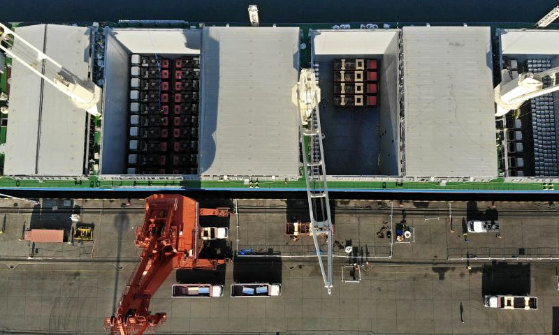 An aerial drone photo taken on Dec. 16, 2024 shows the cargo ship GREEN NAGOYA being loaded at Qingdao Port in Qingdao, east China's Shandong Province. The vessel is expected to arrive at the Dar es Salaam Port in Tanzania in about 20 days. A new direct shipping route between China's Qingdao and southeast Africa was officially opened on Monday. Running on a weekly basis, this route adds a safe and fast maritime shipping alternative between China and Africa. (Xinhua/Li Ziheng)