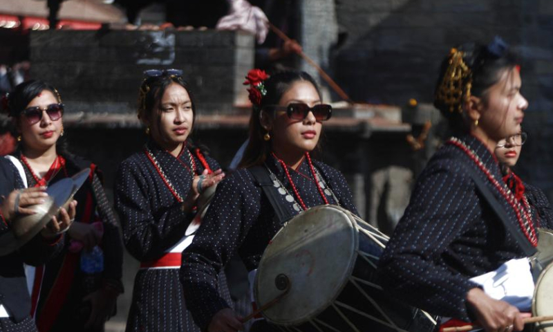 Women in traditional attire perform during a rally held to celebrate Yomari Punhi in Kathmandu, Nepal, Dec. 15, 2024. Yomari Punhi is a festival especially celebrated by Newar community in Nepal to mark the end of the rice harvest on full moon day. (Photo by Sulav Shrestha/Xinhua)