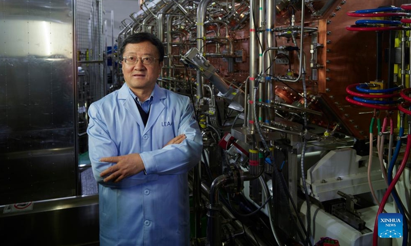 Zhao Hongwei, an academician of the Chinese Academy of Sciences (CAS), poses for a photo in front of the low-energy high-intensity heavy-ion accelerator facility (LEAF) on Dec. 10, 2024. (Photo: Xinhua)