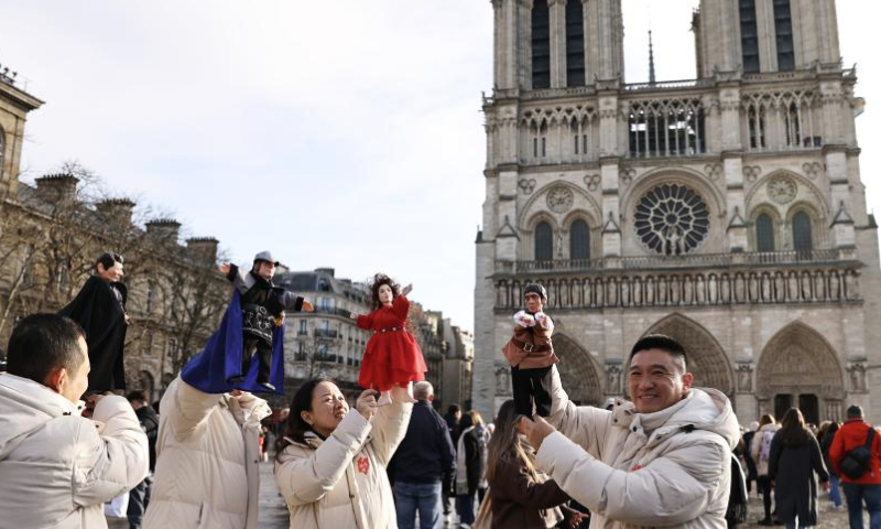 Chinese actors perform a hand-puppet theater play Notre-Dame de Paris in front of the Notre-Dame de Paris cathedral, in Paris, France, Dec. 15, 2024. Chinese actors staged a flash mob performance of hand-puppet theater play Notre-Dame de Paris in front of the newly reopened Notre-Dame de Paris cathedral, as part of the Chinese Tour in France's Most Beautiful Villages, an event designed to boost Franco-Chinese cultural exchanges. (Xinhua/Gao Jing)