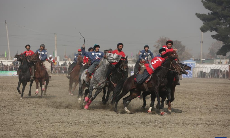 People participate in Afghanistan's traditional sport Buzkashi (goat grabbing) in Kabul, Afghanistan, on Dec. 11, 2024. In the game, which will last for 10 days, the horse riders would do their best to grab the carcass of a calf and put it in the circle specified on the game ground. (Photo: Xinhua)