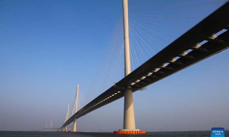 A drone photo taken on Dec. 7, 2024 shows a view of Gaolan Port Bridge (with twin main towers on the left) and Huangmaohai Bridge (with three main towers on the right) in south China's Guangdong Province. (Photo: Xinhua)