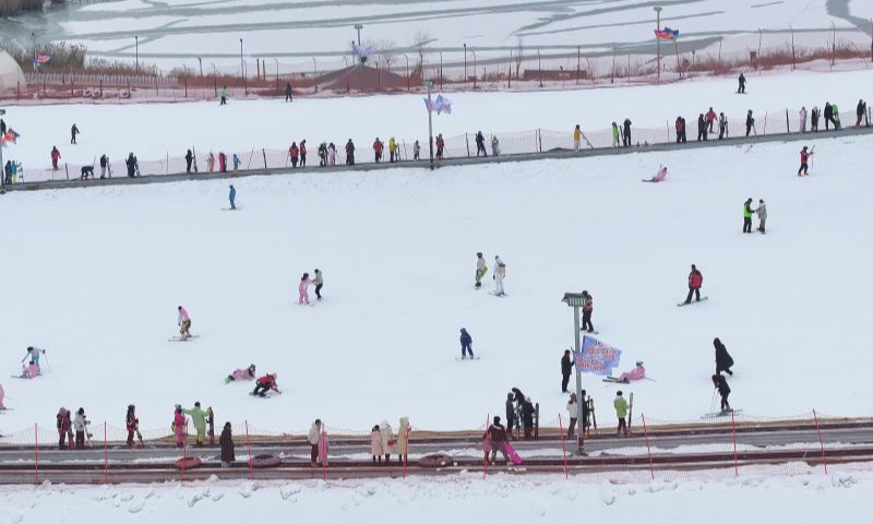 In this aerial drone photo, tourists ski at Yuehai Ski Resort in Yinchuan, northwest China's Ningxia Hui Autonomous Region, Dec. 22, 2024. (Xinhua/Wang Peng)