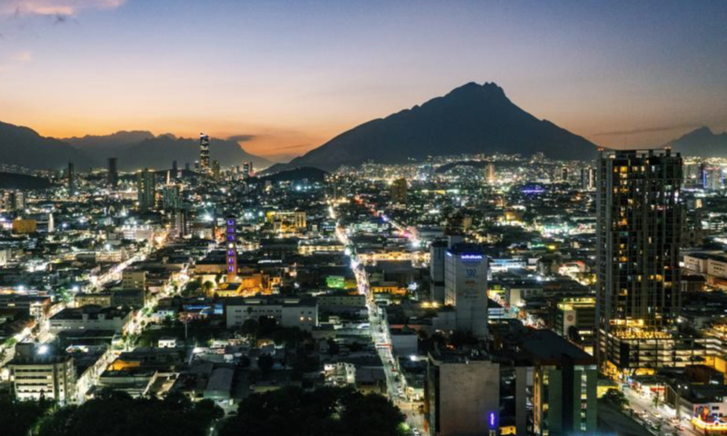 This aerial drone photo shows a night view of Monterrey in Mexico, Dec. 10, 2024. Monterrey, the capital of Nuevo Leon in northeastern Mexico, is the country's third-largest city, renowned for its thriving industrial and commercial activities. As an important economic hub in Mexico, Monterrey is home to numerous multinational companies and manufacturing centers. (Xinhua/Li Muzi)