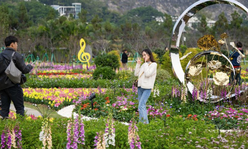 People visit a flower show on Taipa Island in Macao, south China, Dec. 14, 2024. A flower show celebrating the 25th anniversary of Macao's return to the motherland kicked off here on Saturday, and will run until Jan. 5, 2025. (Xinhua/Cheong Kam Ka)