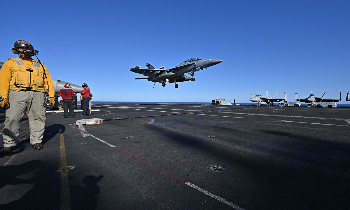 An F/A-18 Hornet fighter jet lands on the deck of the US Nimitz-class nuclear-powered aircraft carrier USS Harry S. Truman, during a NATO vigilance activity NEPTUNE SHIELD 2022 (NESH22) on eastern Mediterranean Sea on May 23, 2022. Photo: VCG