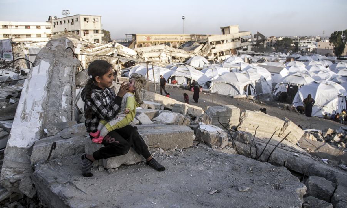 A displaced Palestinian child plays in a shelter in Gaza City on Dec. 9, 2024. (Photo: Xinhua)